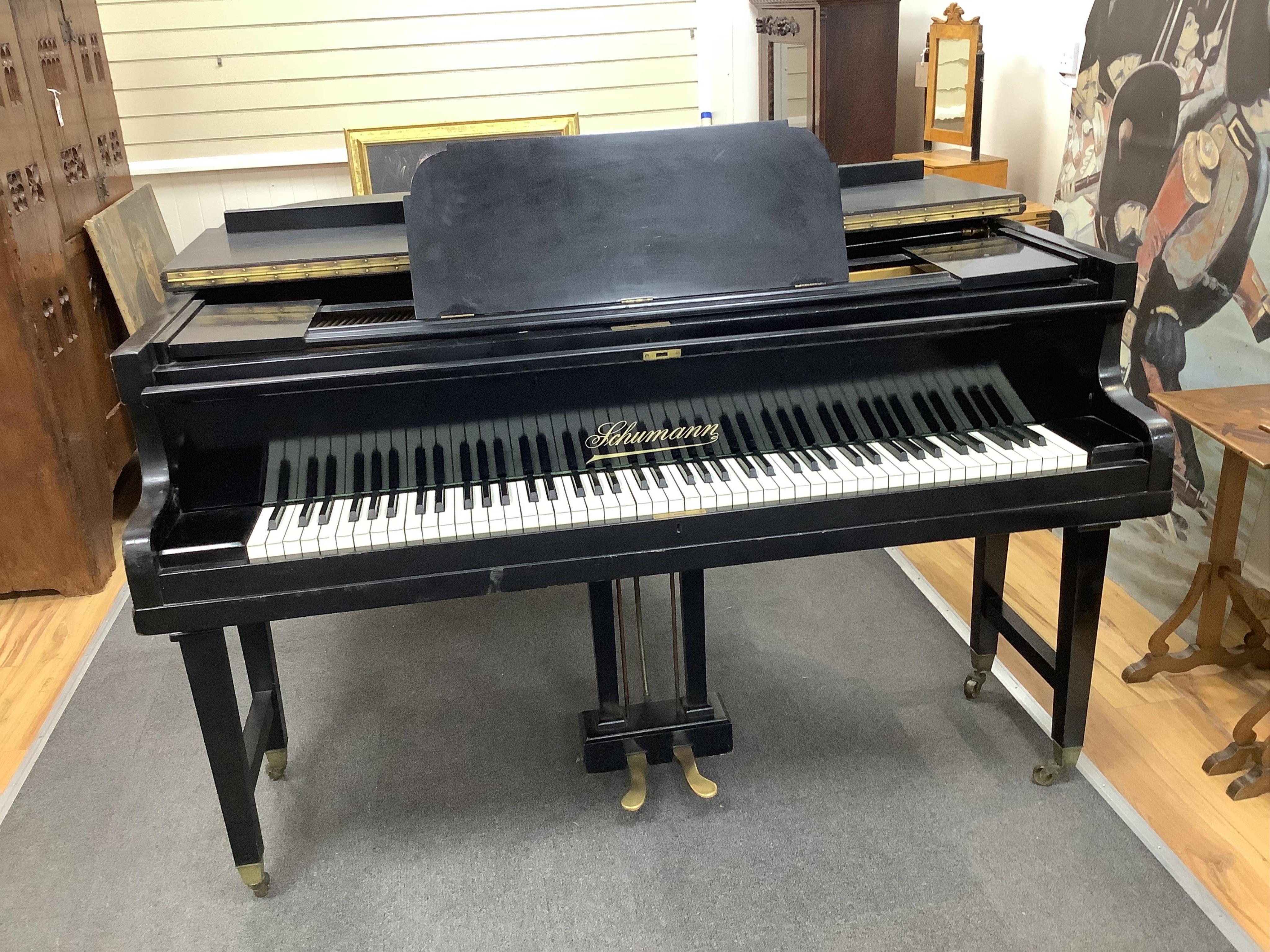 An early 20th century Schumann ebonised boudoir grand piano, length 154cm, width 156cm, height 100cm. Condition - poor